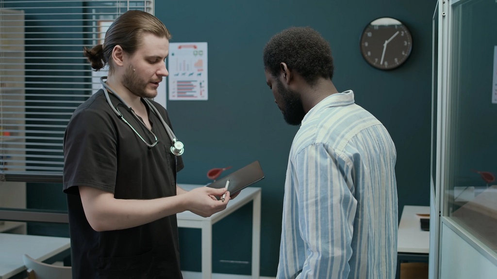 A woman speaking in a professional setting, representing the role of trained interpreters in medical communication